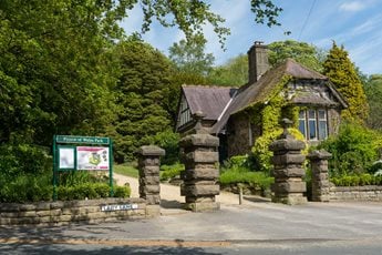 a stone building with a sign