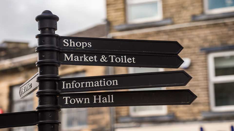 a street sign is posted on a pole