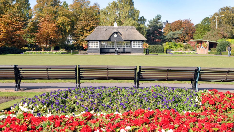 a flower garden in front of a house