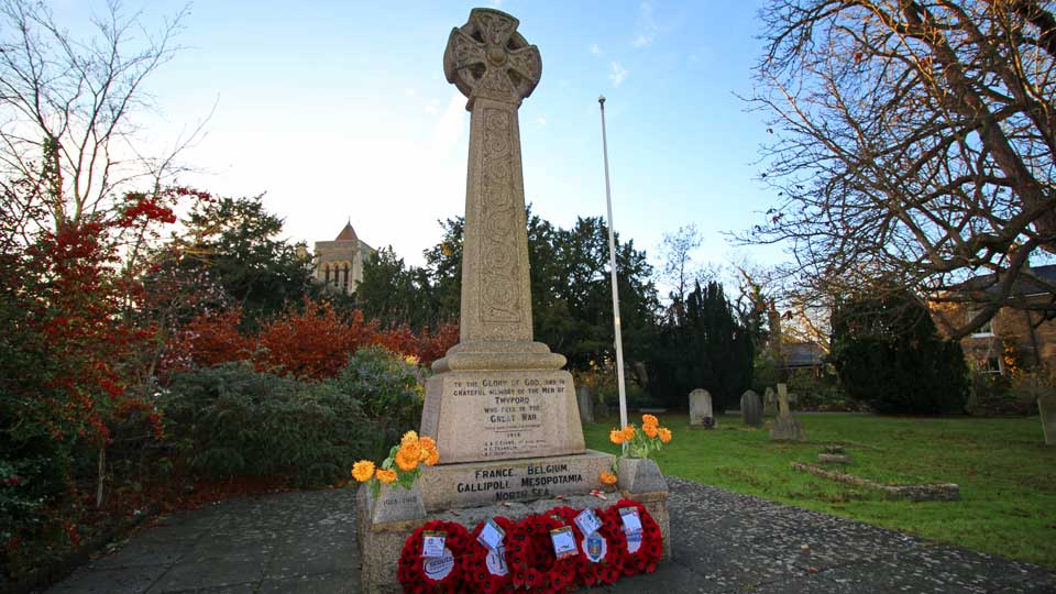 a statue in a cemetery