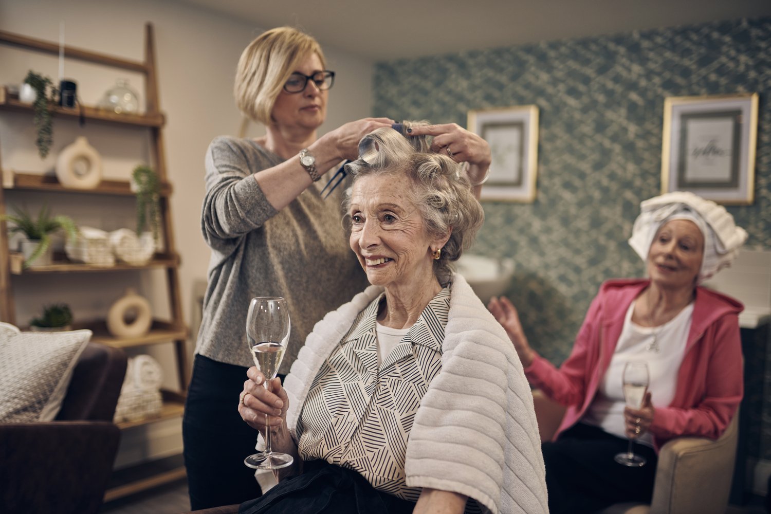 A resident getting their hair cut in the on-site beauty salon of a McCarthy Stone retirement development.