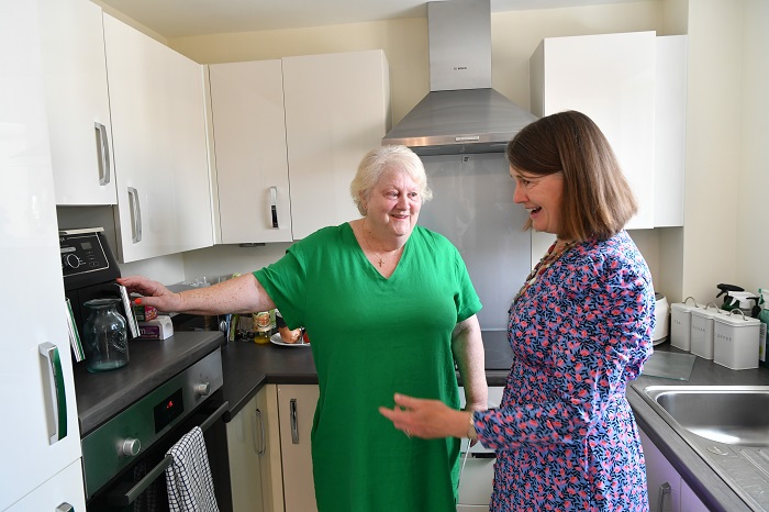 Homeowner Margaret Brannan and Minister Rachael Maclean at Milward Place apartment