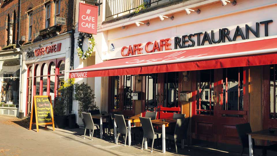 a restaurant with tables and chairs