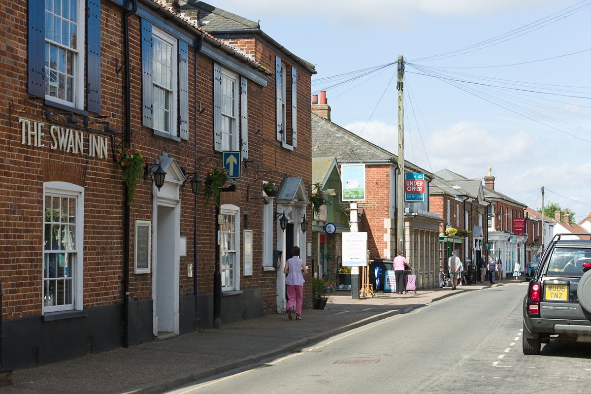 a street with buildings and people