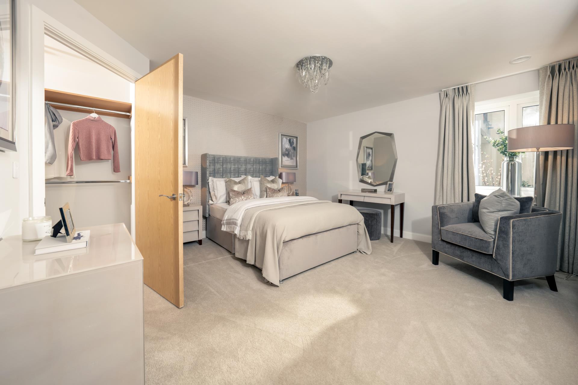 a bedroom with a bed and a chair