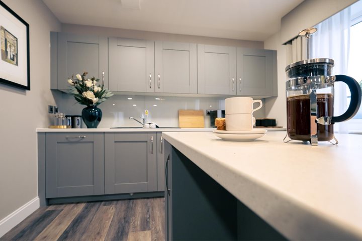 a kitchen with white cabinets
