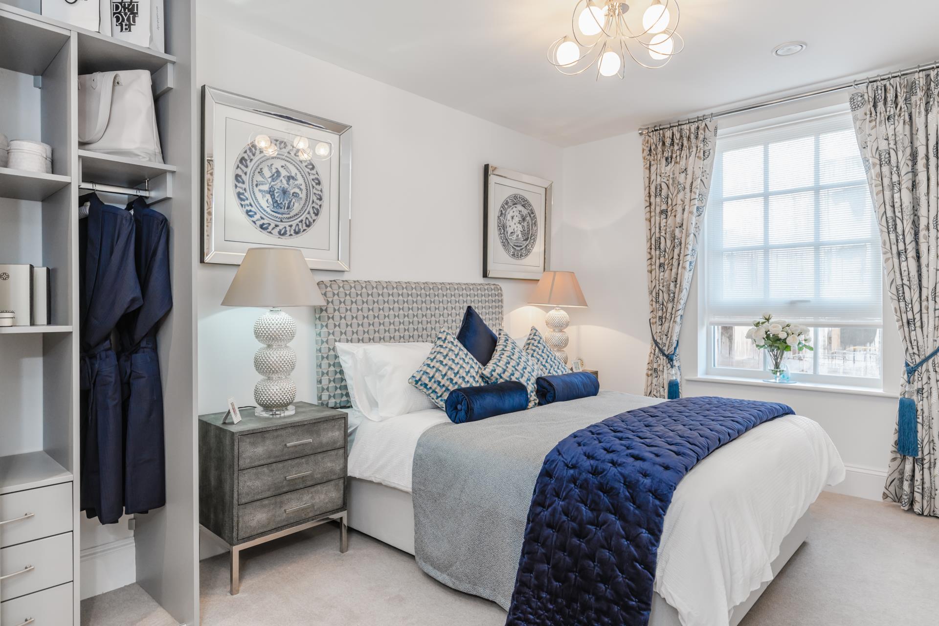 a bedroom with a bed and a lamp