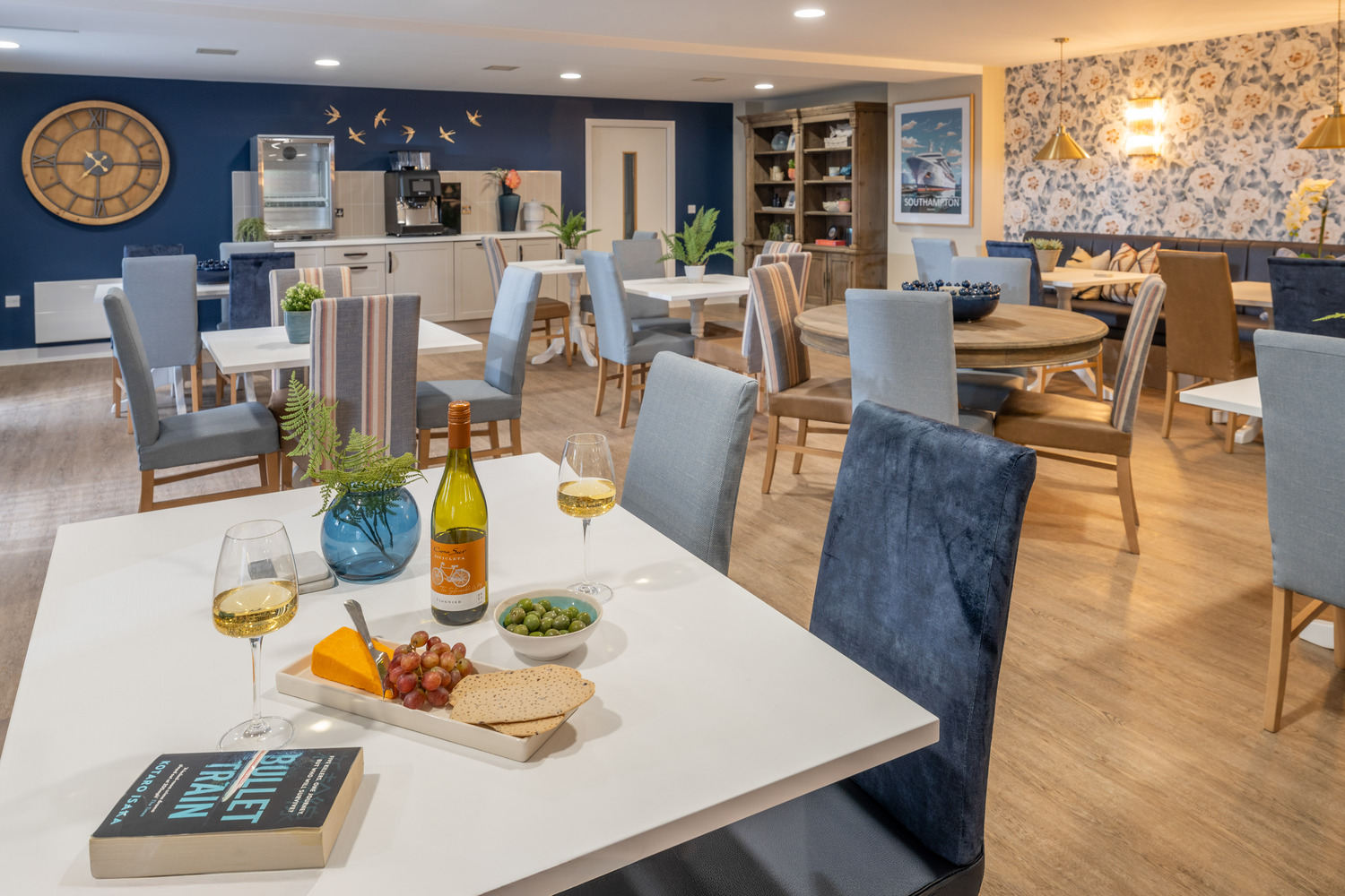 a dining room with a table and chairs