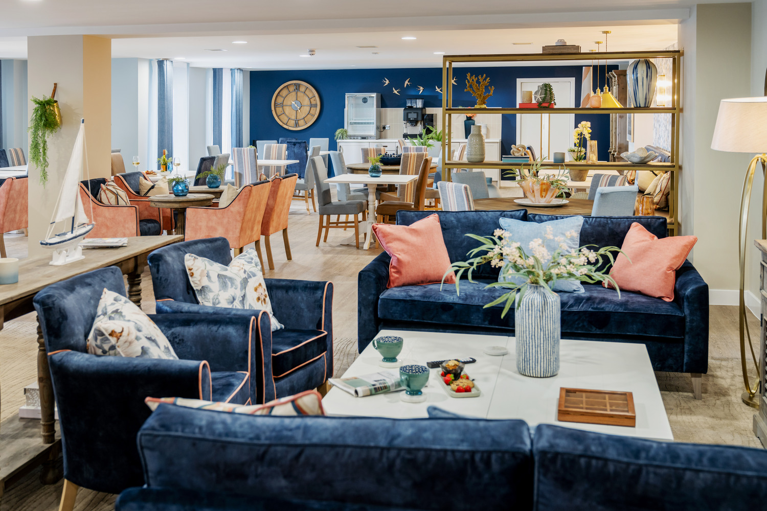 a living room with blue couches