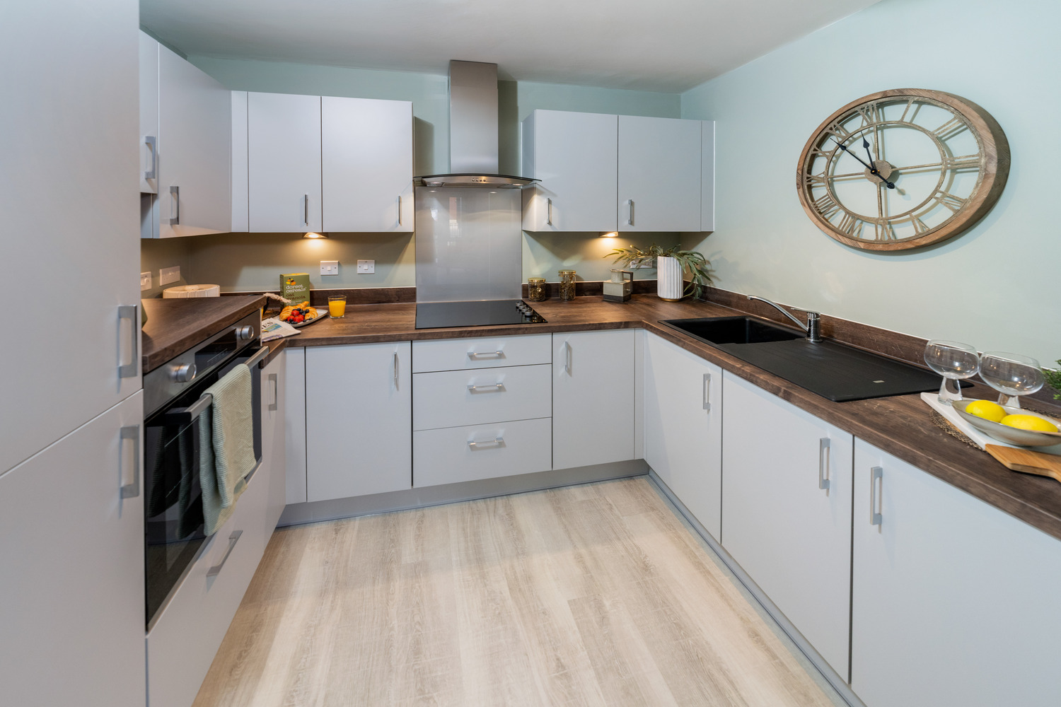 a kitchen with white cabinets