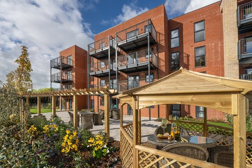 a building with a garden in front of it