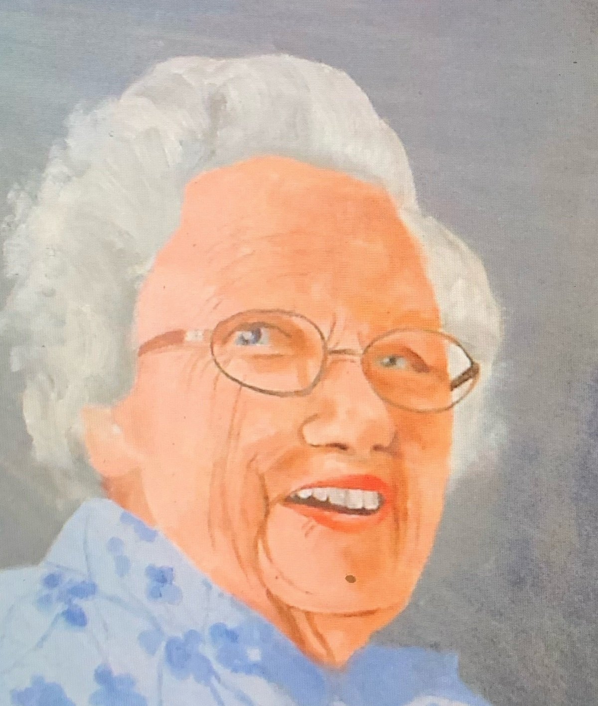 A portrait of an old lady with glasses and a blue blouse