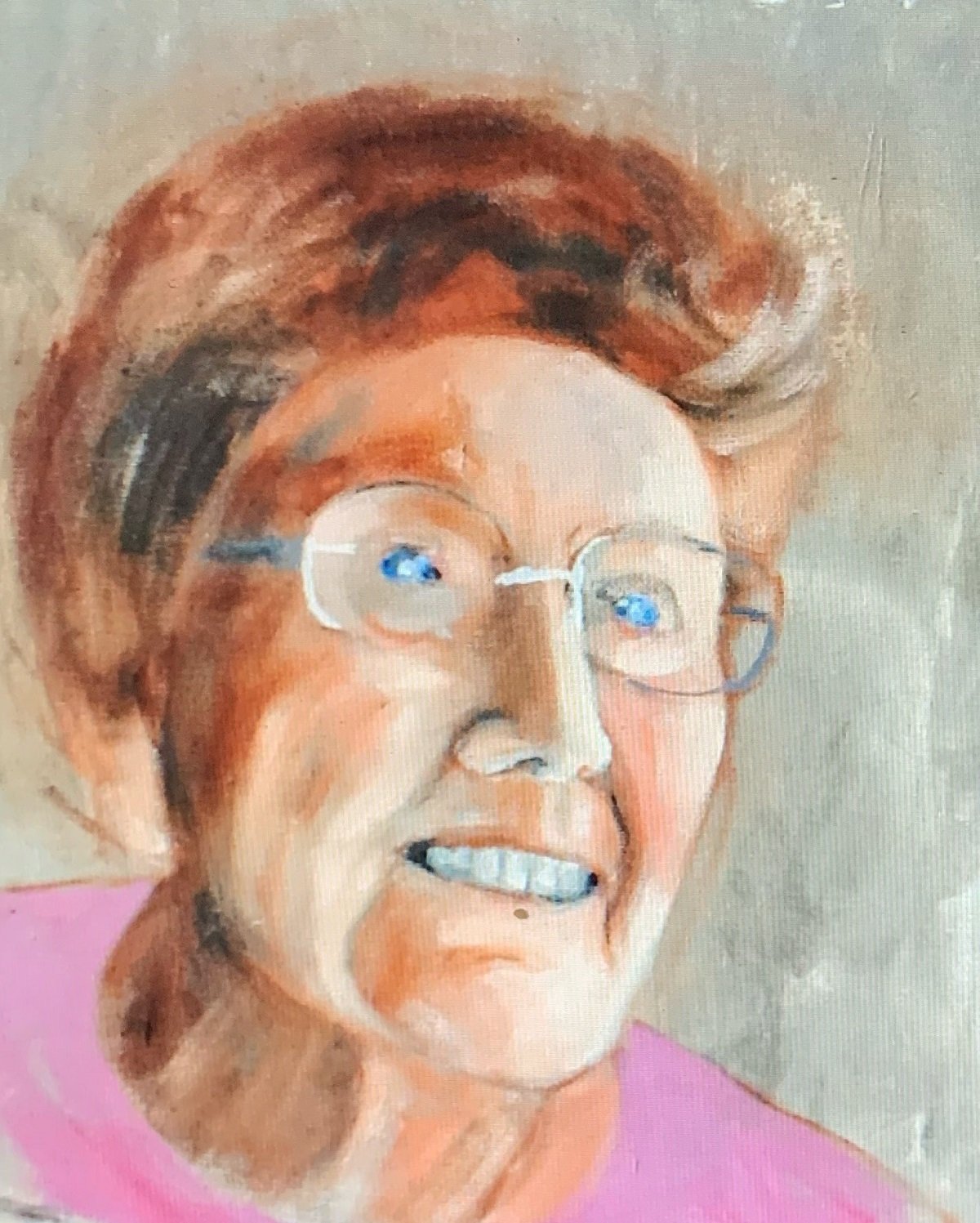A portrait of an old lady with glasses and a pink top