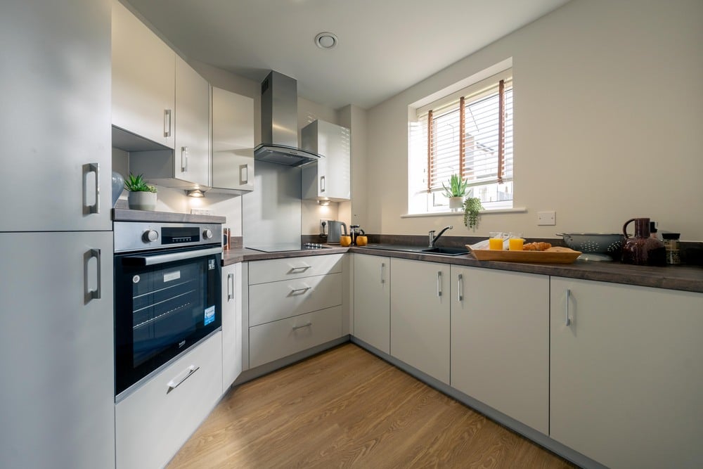a kitchen with white cabinets