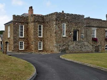 a stone building with a road