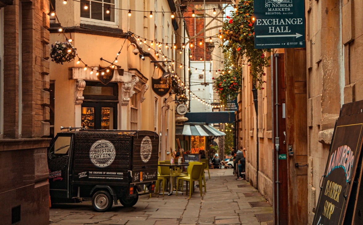 A side street in Bristol with café seating