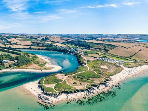 a large area of land with water and trees