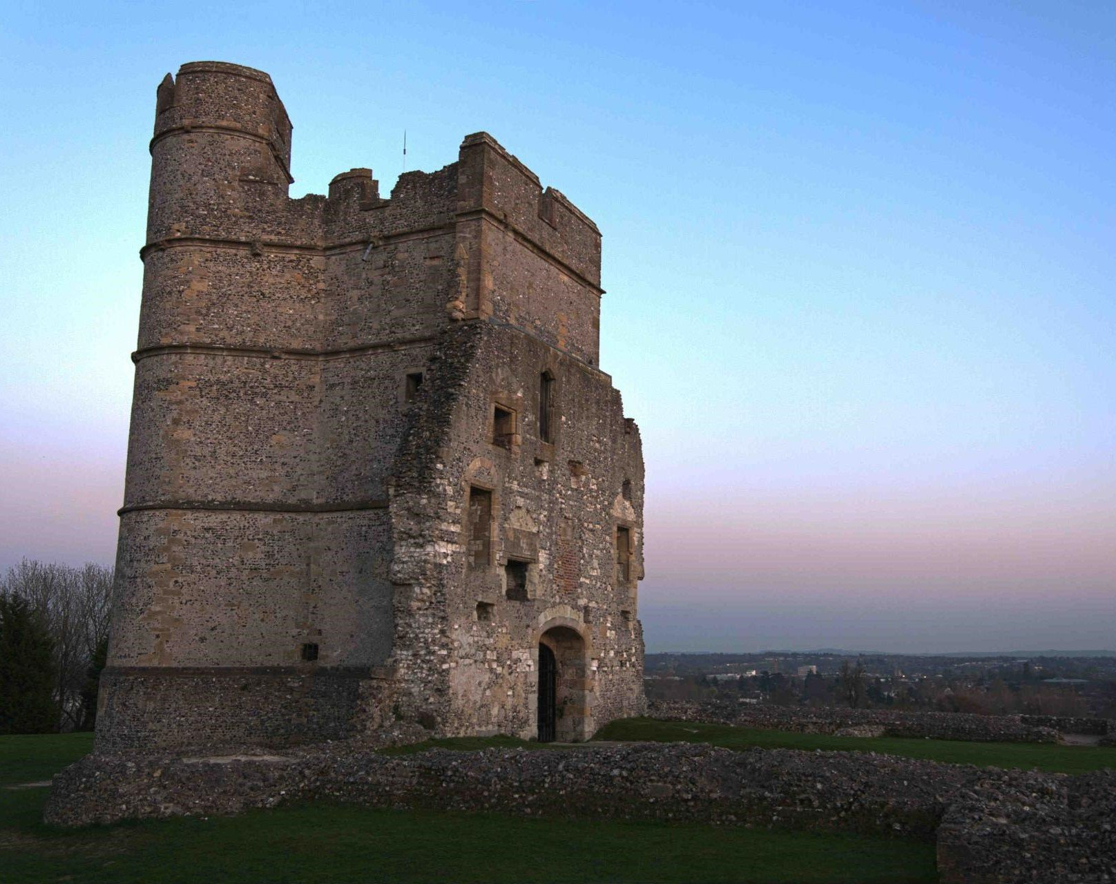 a stone castle with a blue sky