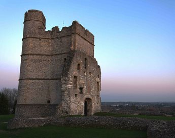 a stone castle with a blue sky