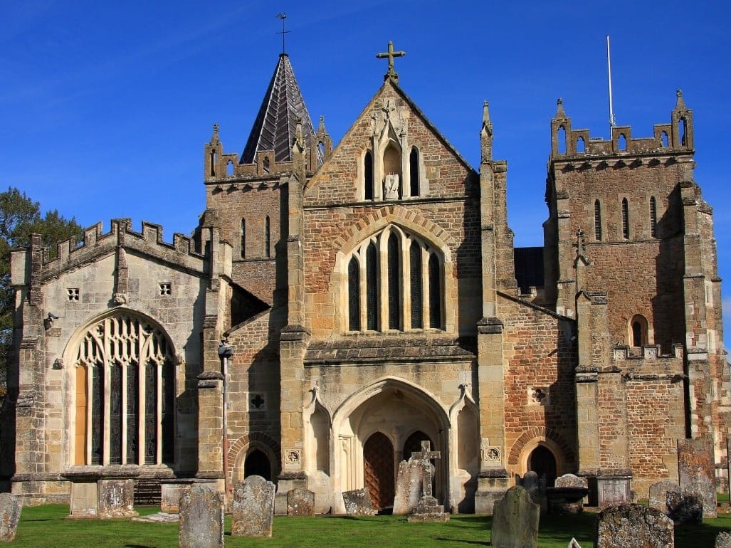 a large stone church with Hereford Cathedral in the background