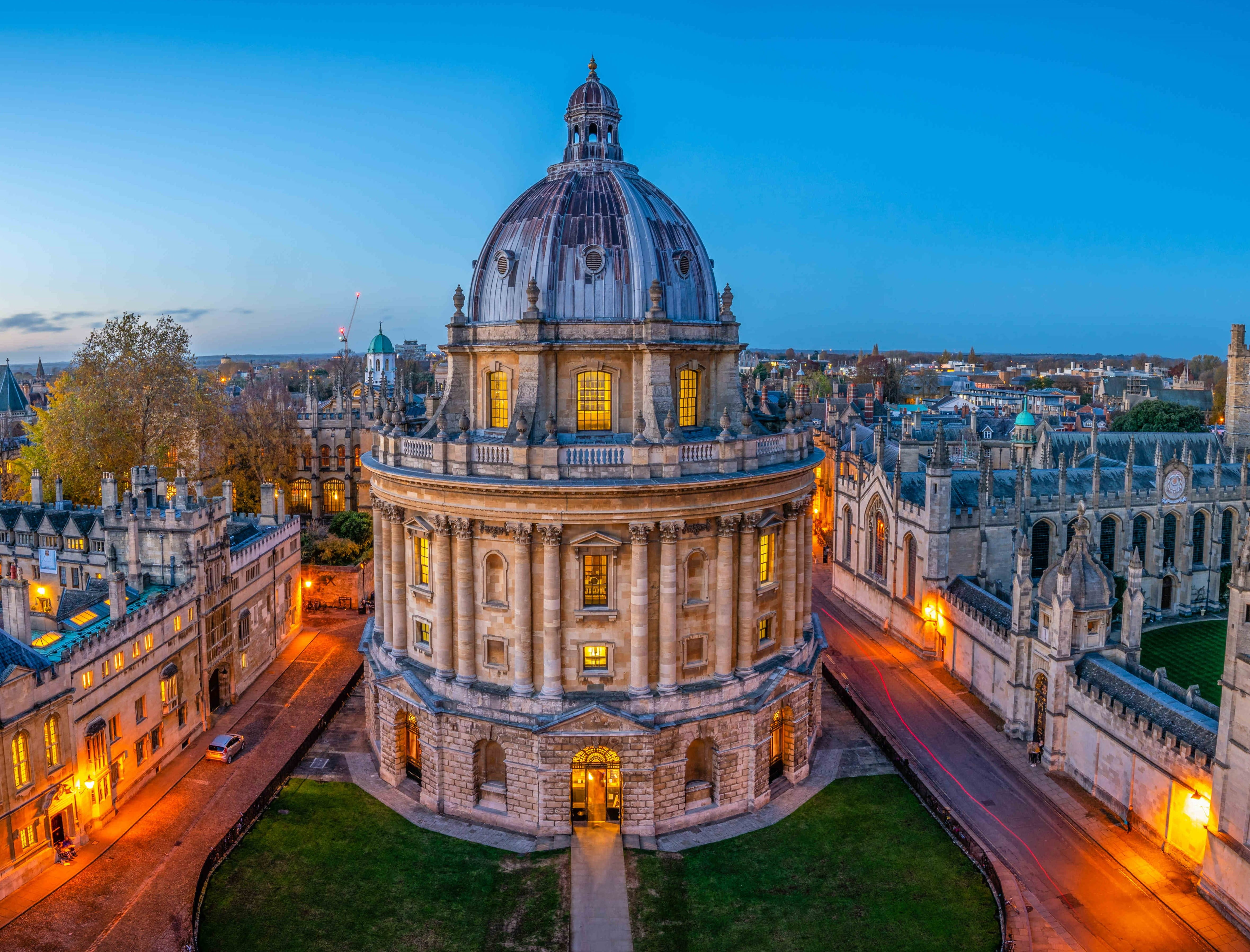 a large building with a dome and a bridge in front of it