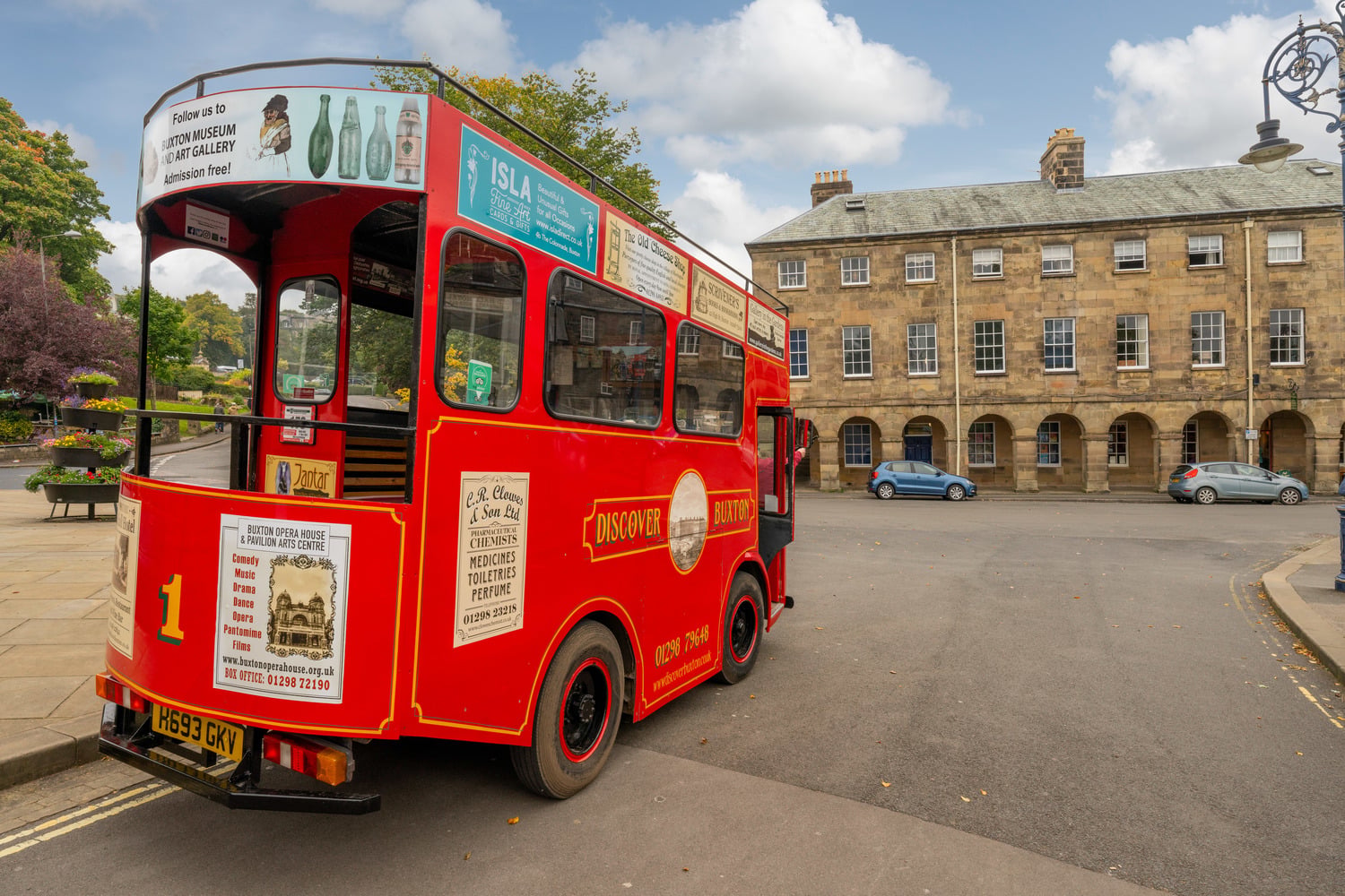 A red bus in Buxton town centre