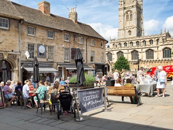 a group of people sitting outside