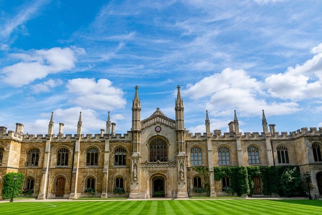 A green lawn in front of a historic Cambridge University building in Cambridgeshire.