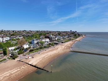 The beach with houses overlooking the sea at Westcliff-on-Sea.