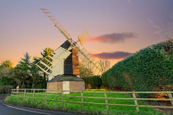 A windmill next to a road in Baldock, Hertfordshire
