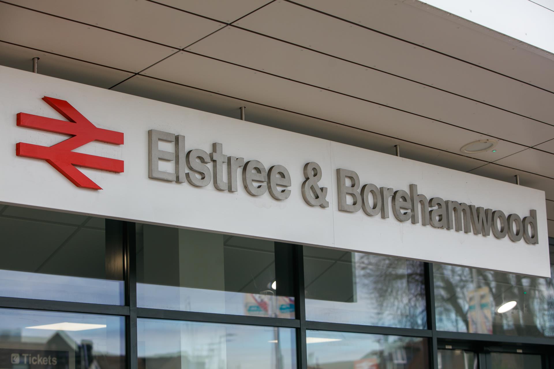 Elmstree and Borehamwood railway station sign and entrance.