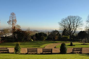 A hint of the London skyline from the green grounds of Harrow School.