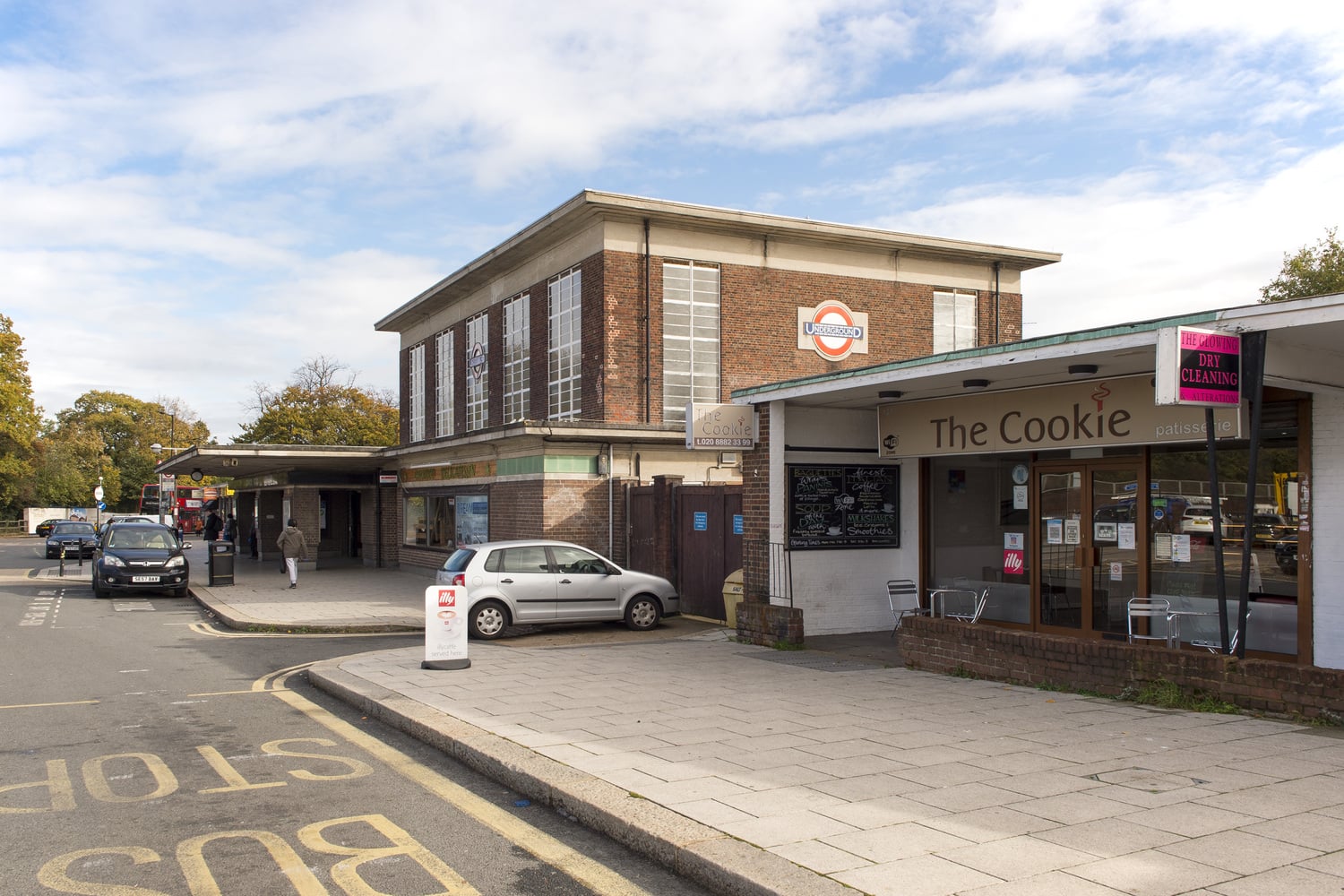 Entrance to Oakwood underground station next to a bakery.