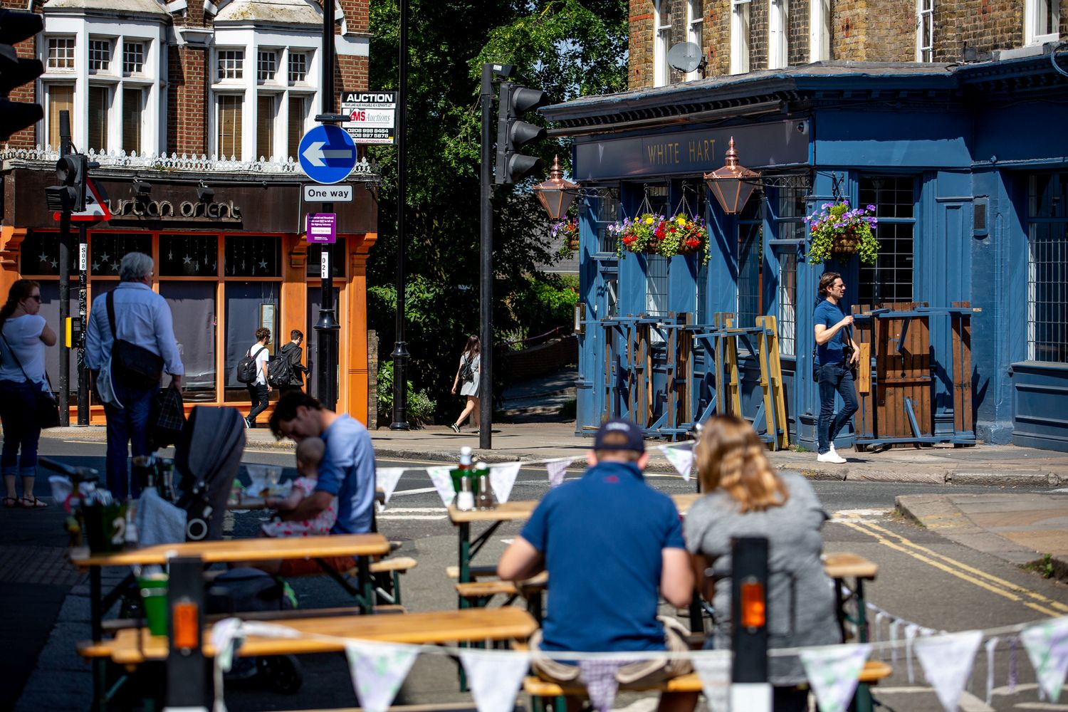 people sitting outside near pub