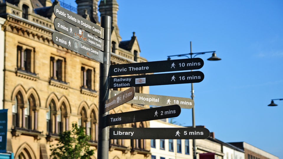 a street sign is posted on a pole