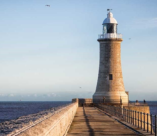 a lighthouse on a pier