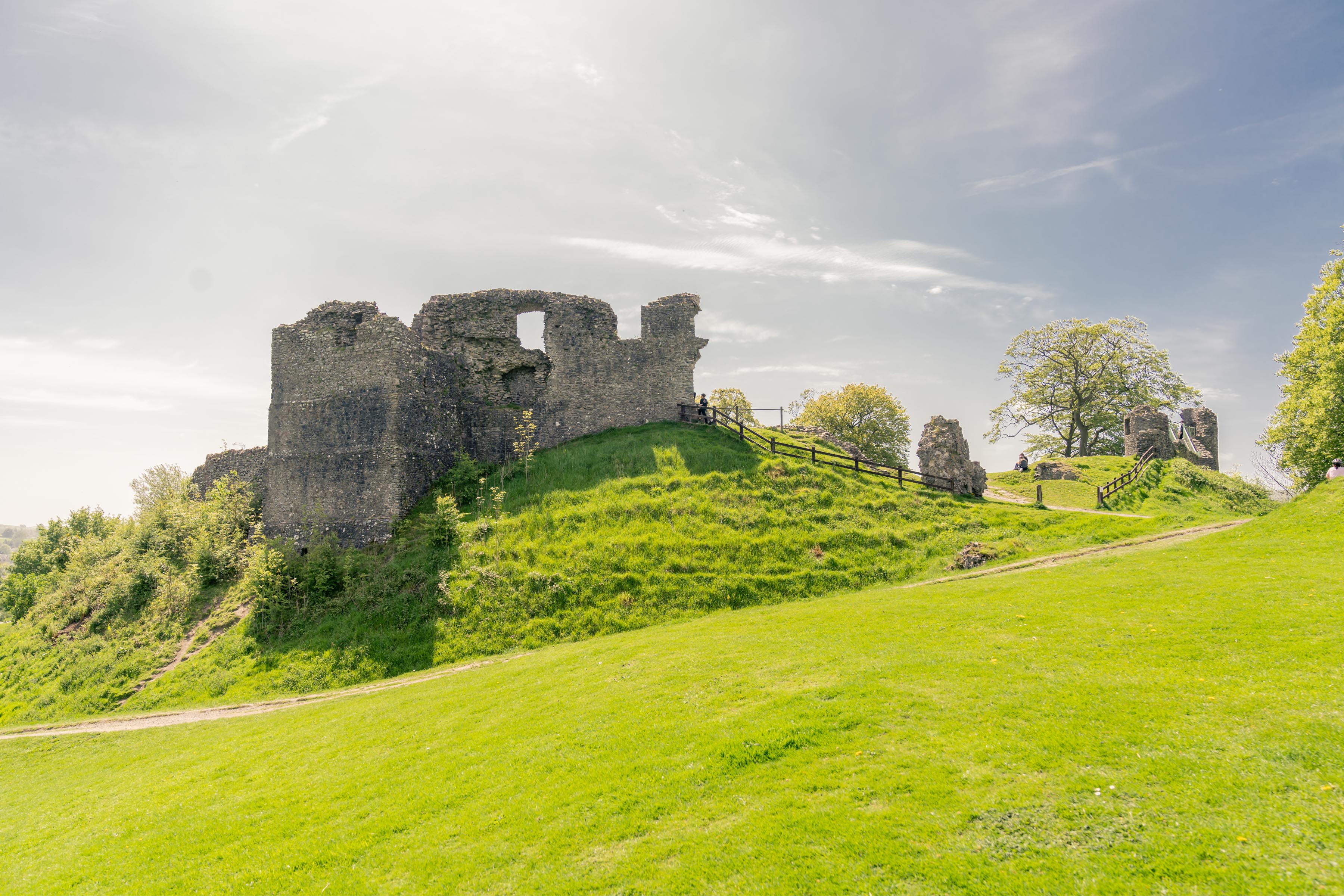 a stone castle on a hill