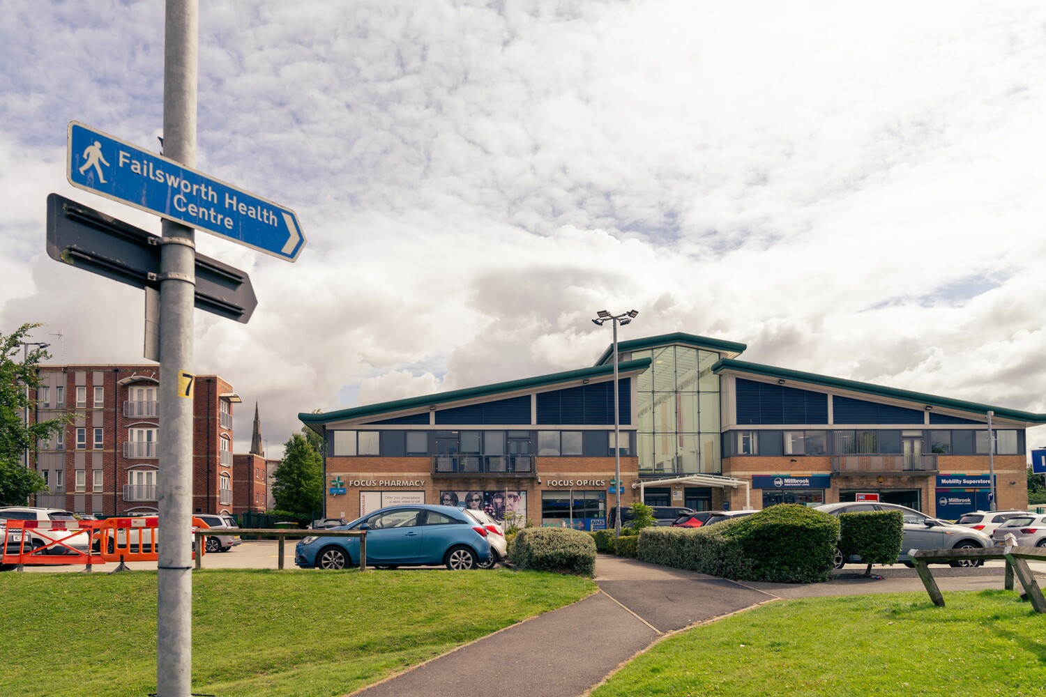 Failsworth health centre with a GP surgery, pharmacy, and mobility store.