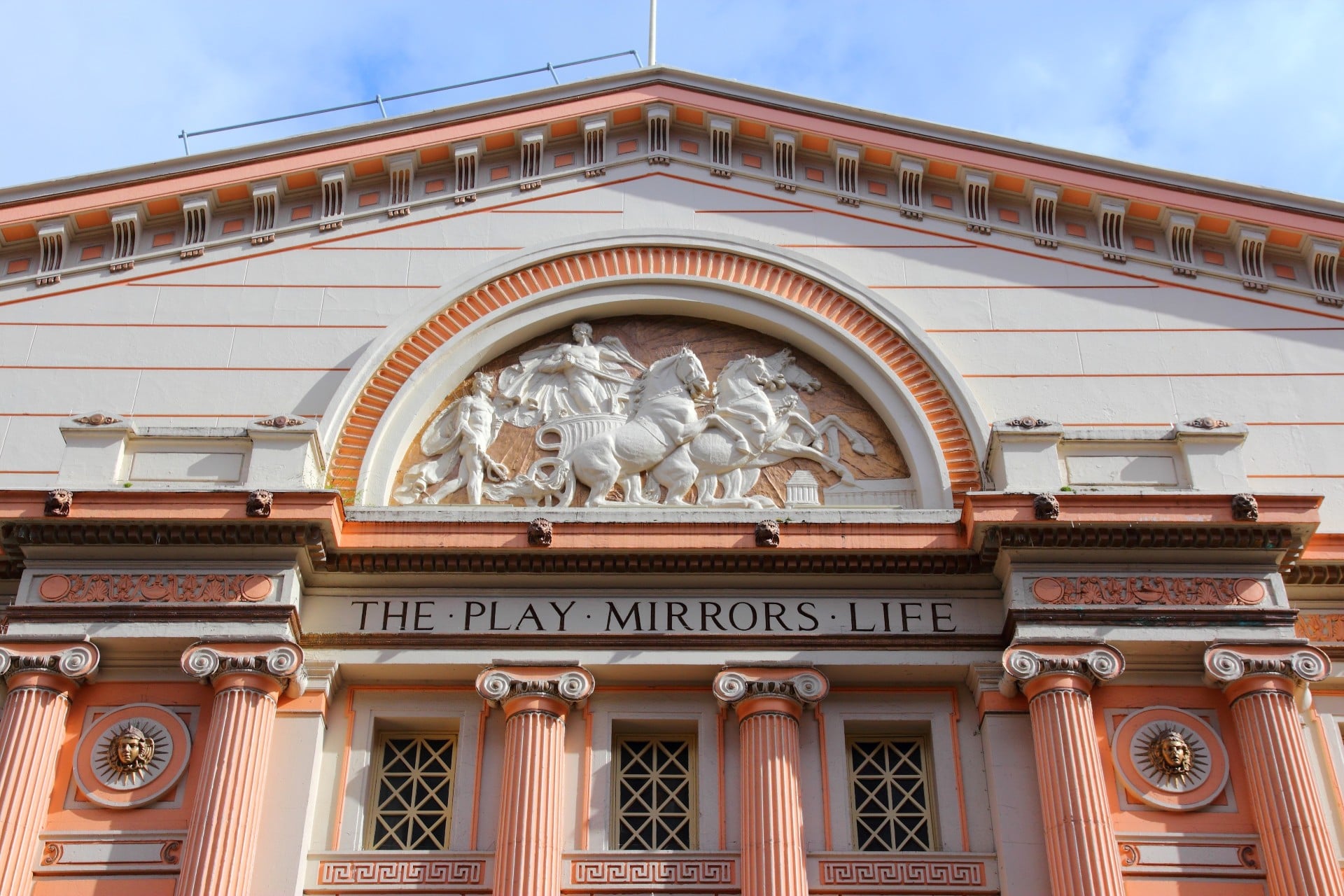 The decorative exterior stonework of Manchester Opera House.