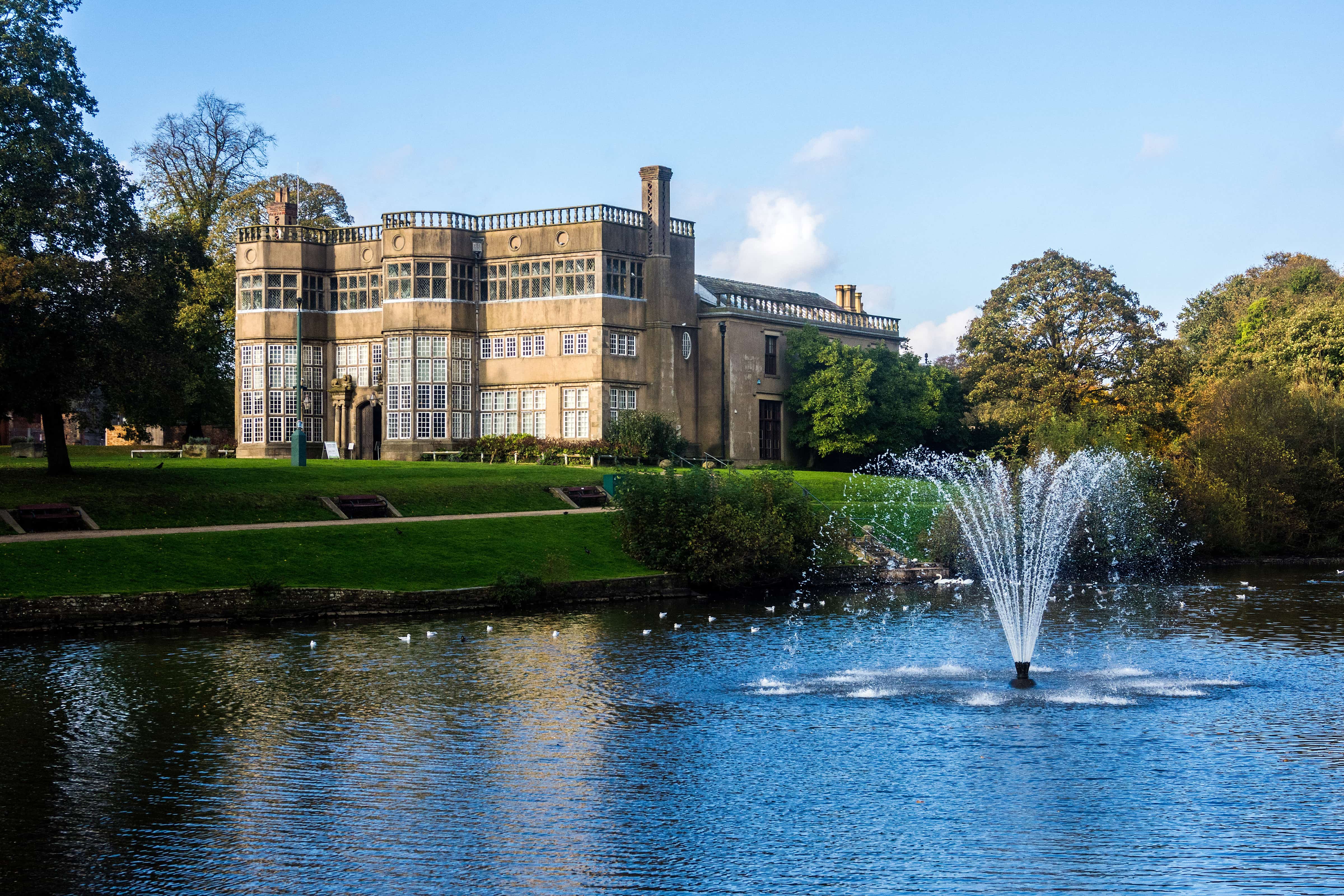 a large building with a fountain in front of it