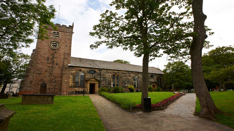 a brick building with a clock