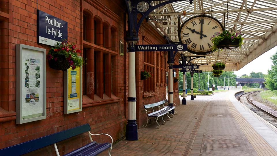 a clock on a brick wall