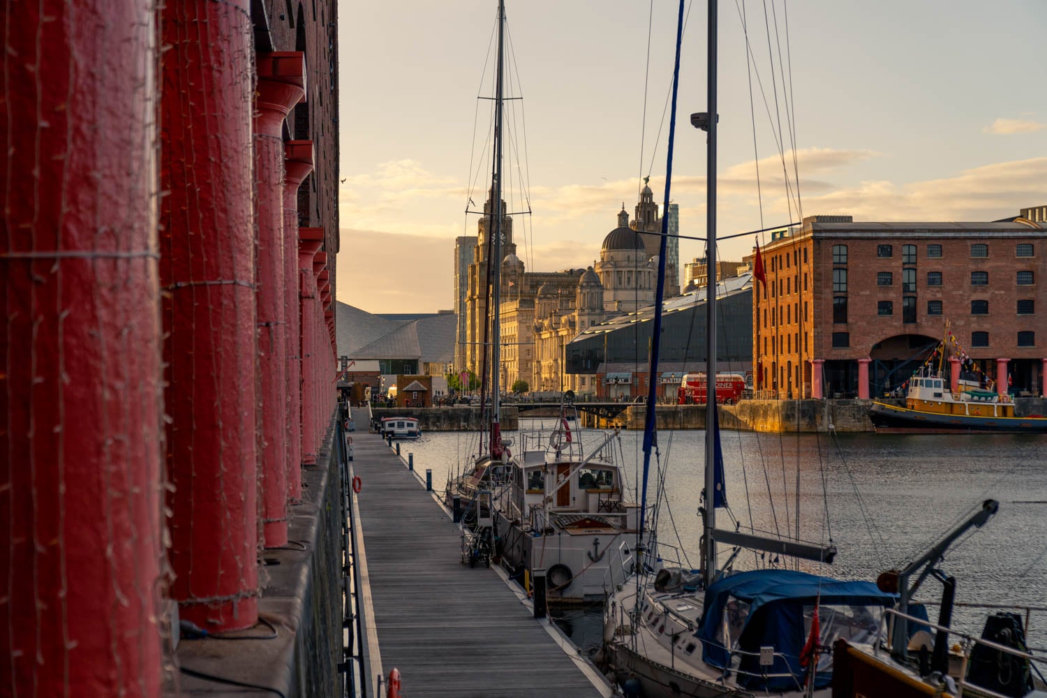 a dock with boats and buildings