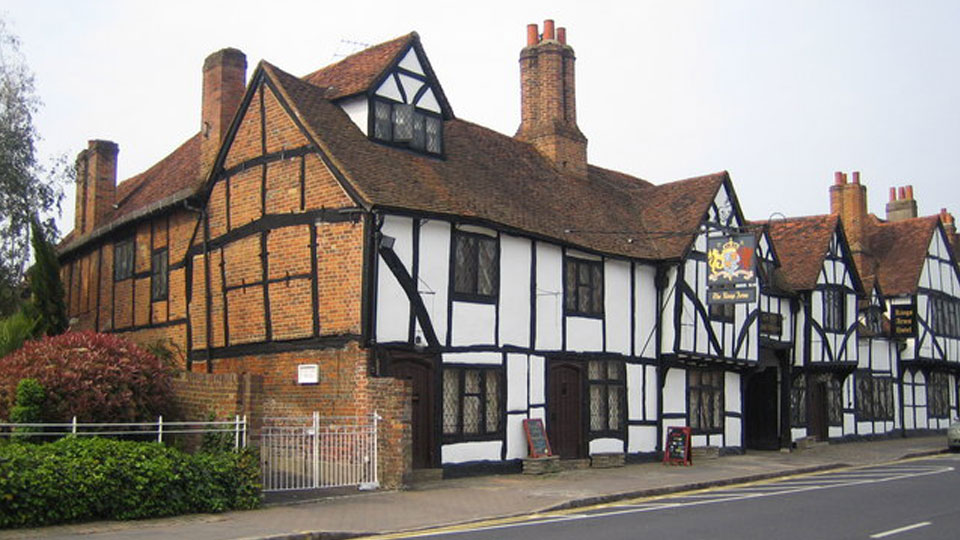 a house with a sign on the front with Shakespeare's Birthplace in the background