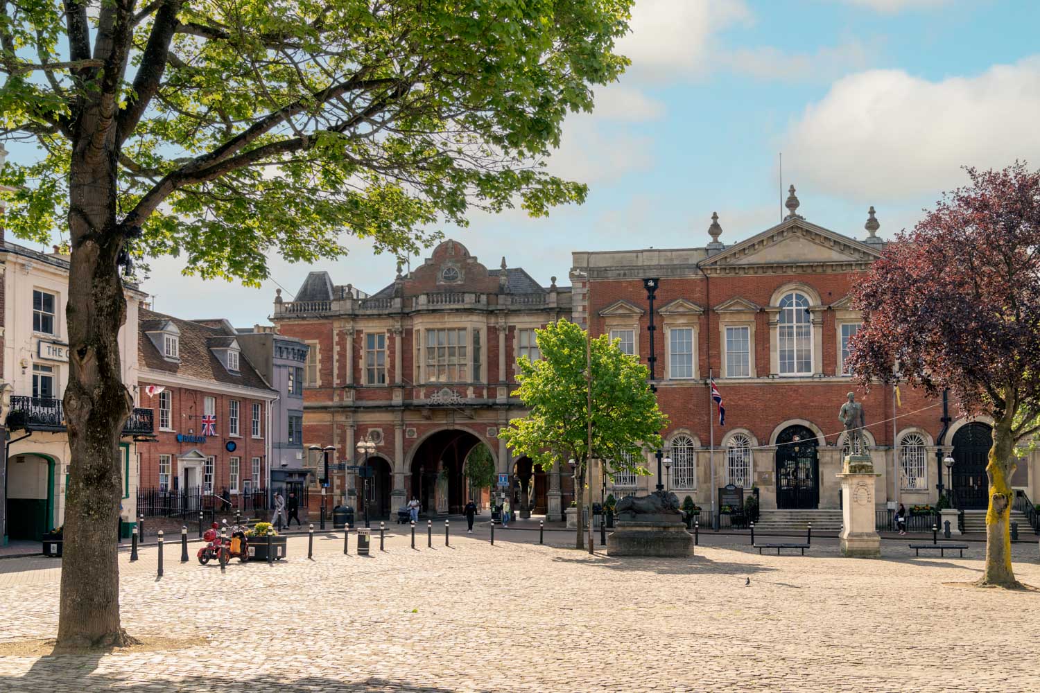 a large brick building with trees in front of it