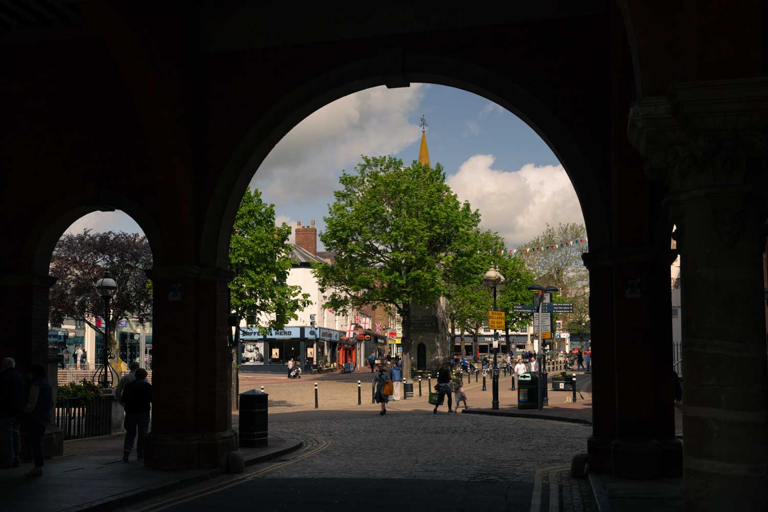 a street with people and trees
