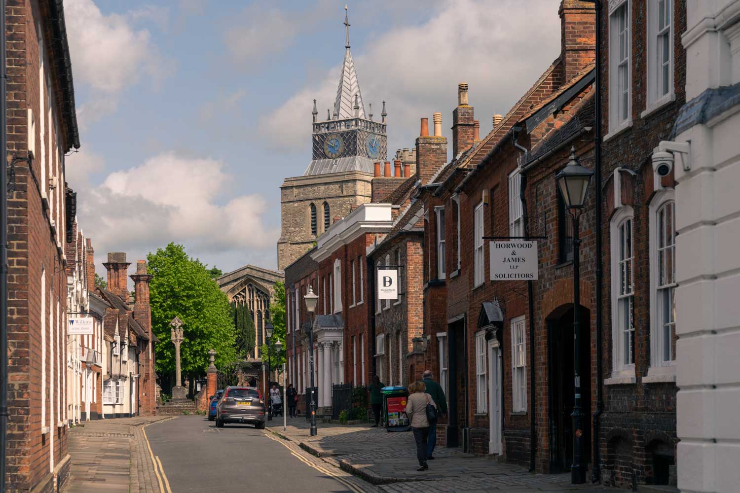 a street with buildings and trees