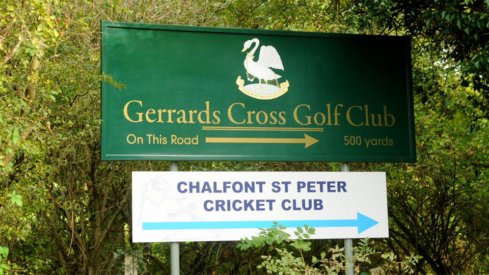 a green sign with a blue and white sign