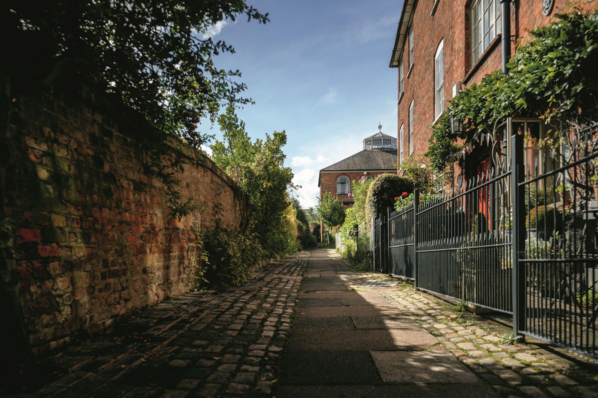 a street with a fence and Beacon Hill with a fence