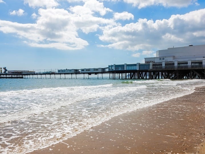 a pier with a building on the side